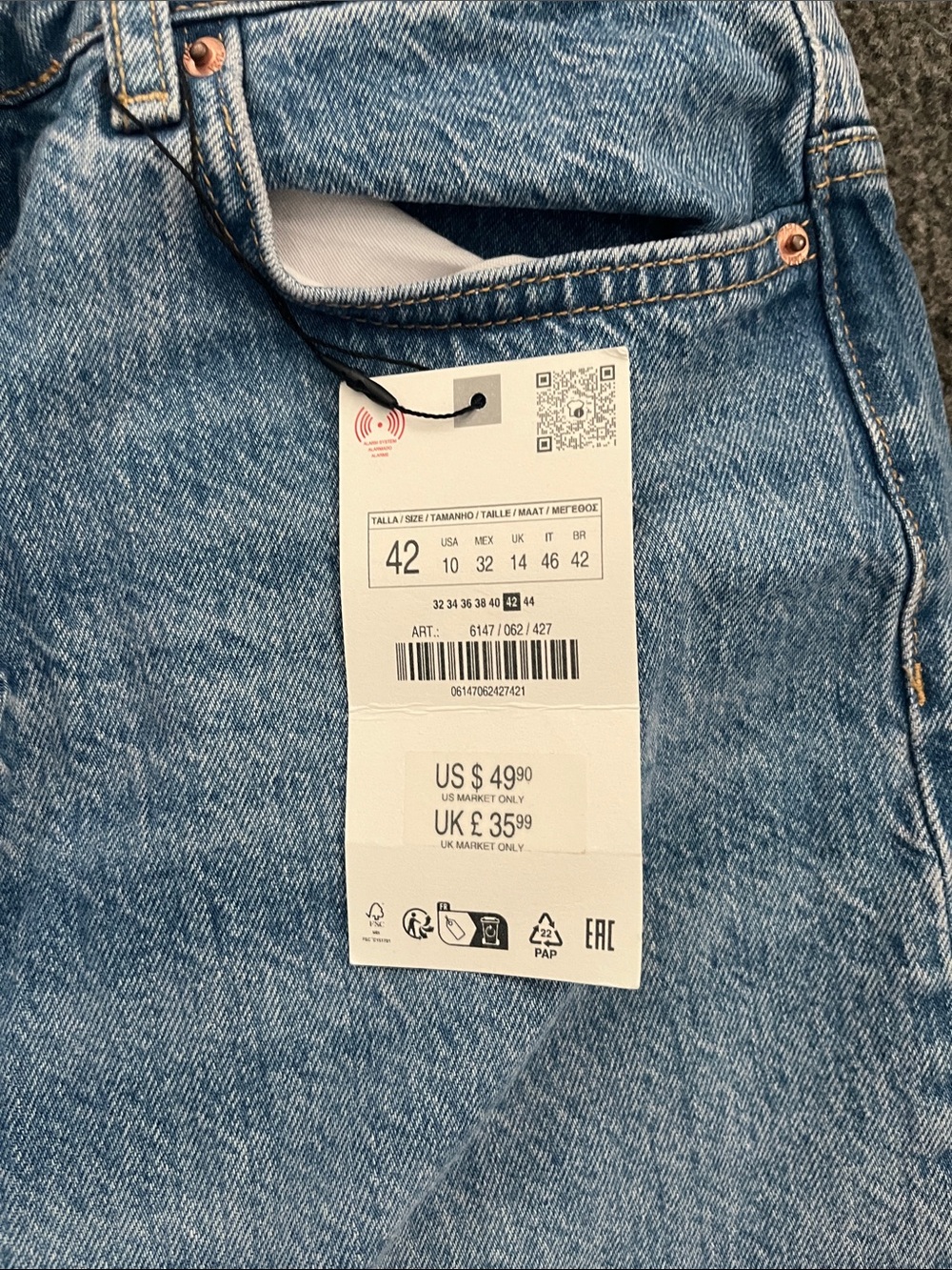 Light Wash Blue Denim Jeans with Price Tag